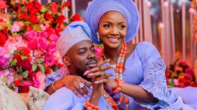 Adekunle Gold Responds to Fan Asking "Who Is Richer Between Him and His Wife, Simi?"